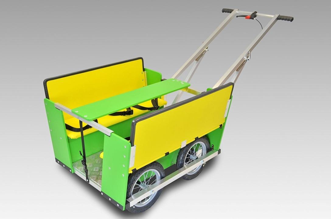 Krippenwagen 6-Sitzer - Kinderwagen in gelb und grün mit Tisch in der Mitte - KiTa-Spielewelt
